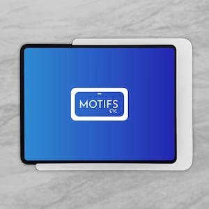 May include: A rectangular tablet device featuring a vibrant blue screen with a centered white graphic containing the text MOTIFS ETC. The device is encased in a white frame that extends slightly beyond the edges of the screen on the right side.