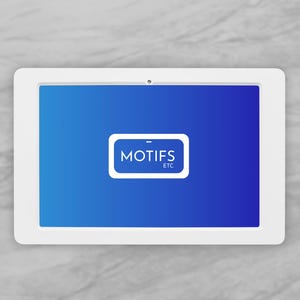 May include: A white tablet with a blue screen displaying the text "MOTIFS ETC" in a white rectangle. The tablet is set against a gray marble background.