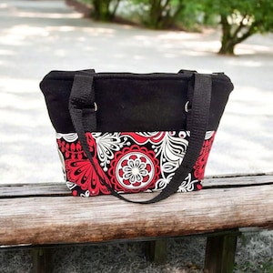 Red and Black Abstract Flower lined insulated zip top lunch bag or sack with straps