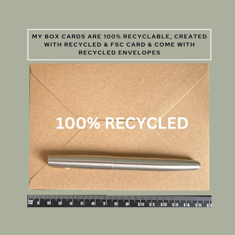 May include: A silver pen rests on a brown envelope with the text "100% RECYCLED". The envelope is on a green background. The text "MY BOX CARDS ARE 100% RECYCLABLE, CREATED WITH RECYCLED & FSC CARD & COME WITH RECYCLED ENVELOPES" is at the top.
