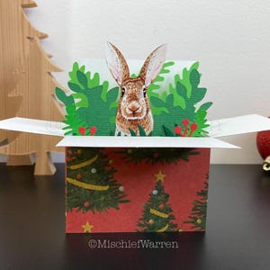 Carte de Noël de lapin brun. Carte de boîte de lapin 3D. Porte-cartes cadeau de Noël.