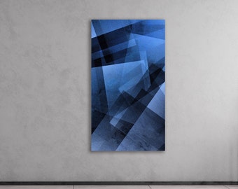 May include: Abstract geometric art print with overlapping blue and gray shapes. The print is hanging on a gray wall in a modern interior.