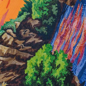 May include: A close-up of a colorful quilt depicting a waterfall cascading over rocks and lush green foliage. The quilt is made with various fabrics and textures, creating a realistic and detailed scene.
