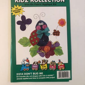 May include: A craft kit for making a felt ladybug applique. The kit includes die-cut shapes, trims, and FUS-O-BOND. The kit is called "Don't Bug Me" and has the product number 51214.