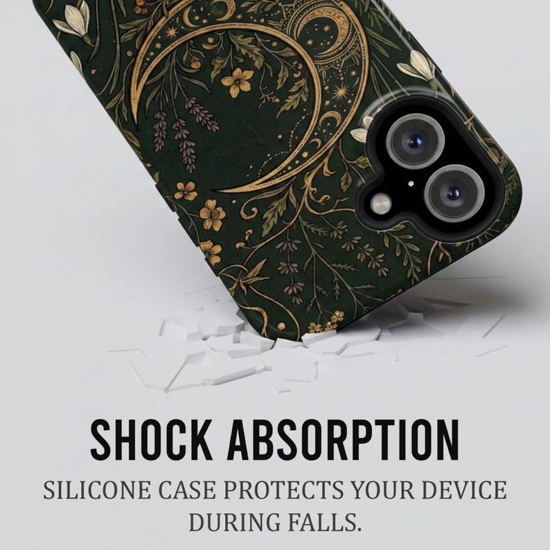 K&ouml;nnte beinhalten: Eine dunkelgr&uuml;ne Handyh&uuml;lle mit einer goldenen Mondsichel und botanischen Illustrationen von Blumen und Bl&auml;ttern. Der Text SHOCK ABSORPTION und SILICONE CASE PROTECTS YOUR DEVICE DURING FALLS steht unter der H&uuml;lle.