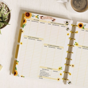 May include: A yellow and white budget planner with sunflower and bee illustrations. The planner has sections for income, fixed expenses, variable expenses, and other expenses. It also has a totals section for tracking income and expenses.