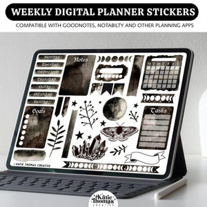 May include: A digital tablet displaying a set of weekly planner stickers with a dark watercolor aesthetic. The stickers include days of the week, a calendar, a moth, crystals, moon phases, leaves, stars, and labels for notes, goals, and tasks.
