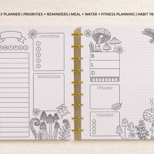 May include: A disc-bound planner spread featuring an hourly planner, priorities, reminders, meal, water, and fitness planning, and a habit tracker. The pages include black and white line art of mushrooms, a dragonfly, a snail, and flowers.