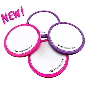 May include: Four circular tokens with white centres and pink and purple rims. The text "NEW!" is in pink, and the website "INFINITOKENS.COM" is printed on the tokens.