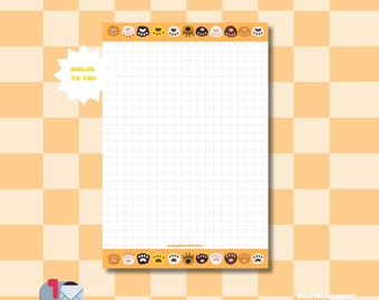 May include: A notepad with a grid pattern and paw print border. The notepad is 14 cm x 22 cm and has the text "MAILED TO YOU" on a starburst. The notepad has 50 sheets.