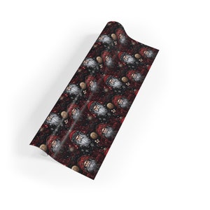 May include: Red and white Santa Claus faces on a black background with gold glitter. The wrapping paper features a repeating pattern of Santa Claus faces.