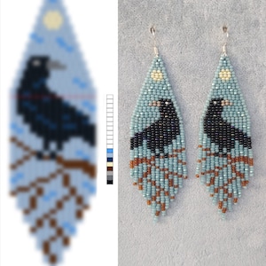 May include: A pair of beaded earrings with a blue and brown colour scheme. Each earring features a black raven perched on a branch with a small yellow moon in the background.