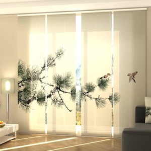 May include: A set of four vertical panel blinds in a light cream color featuring a printed design of a dark green pine branch extending across the panels with small brown birds perched on the needles and one bird in flight to the right side.