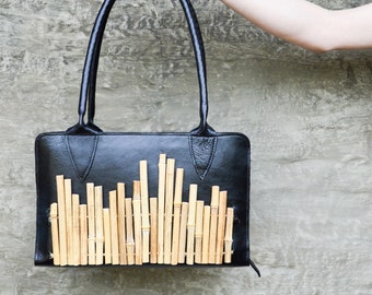 Bagboo ; statement bag ; black leather ; bamboo sticks ; panflute