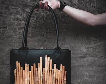 Bagboo ; statement bag in black leather with bamboo sticks ; panflute design