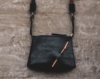 The Stick ; small leather handbag ; bag with bamboo details ; minimalist bag