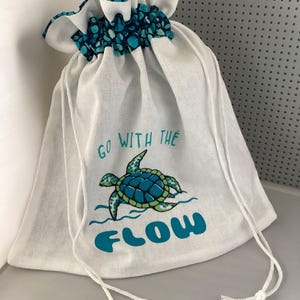 May include: A set of three ceramic mugs with a speckled, matte finish. The mugs are in shades of cream, light gray, and dark gray. Each mug has a simple, minimalist design, perfect for coffee or tea.