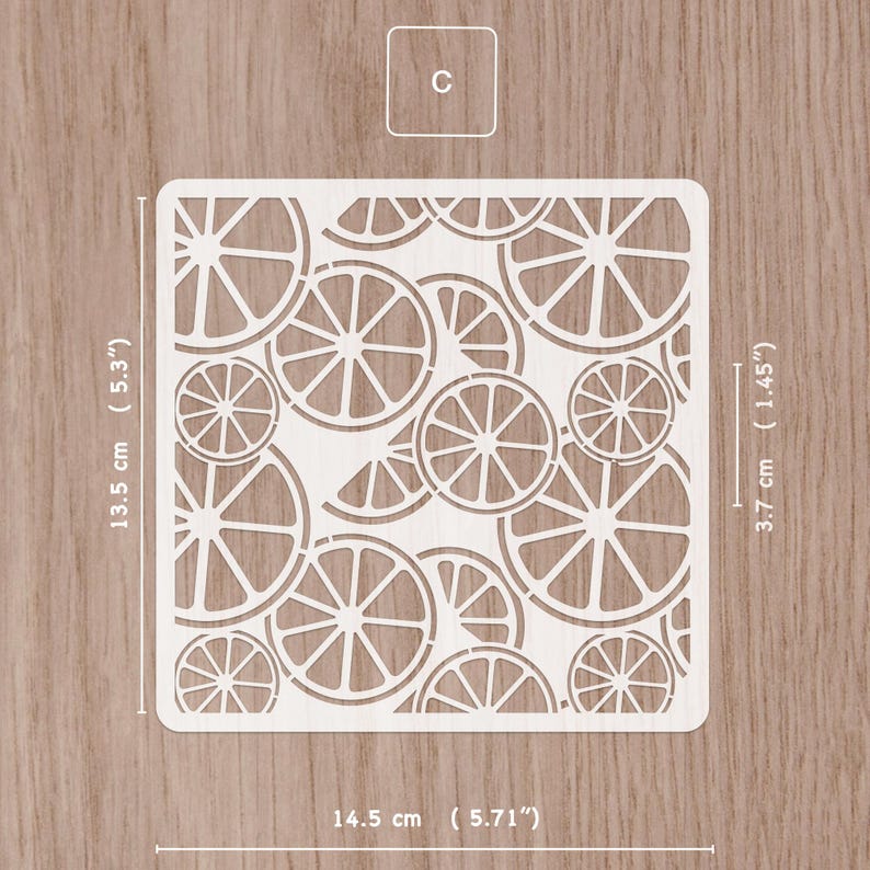 May include: A white square stencil featuring a pattern of orange slices. The stencil measures 5.71 inches wide and 5.3 inches tall. The stencil has a small square with the letter "C" in the upper left corner. The stencil is 1.45 inches wide.