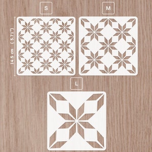 May include: Three white stencil sheets with a geometric star pattern. The stencils are labeled S, M, and L, indicating their size. The stencils are 14.5 cm (5.71 inches) tall.