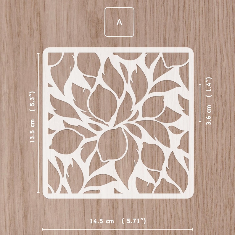 May include: A white, square stencil with a lemon and leaf design. The stencil measures 5.71 inches wide, 5.3 inches tall, and 1.4 inches thick. The letter "A" is in the upper left corner.