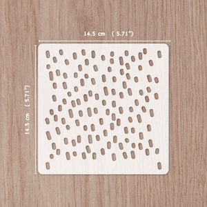 May include: White plastic stencil with a 14.5 cm by 14.5 cm square design of small and medium sized circles and ovals. The stencil is for crafting and decorating.