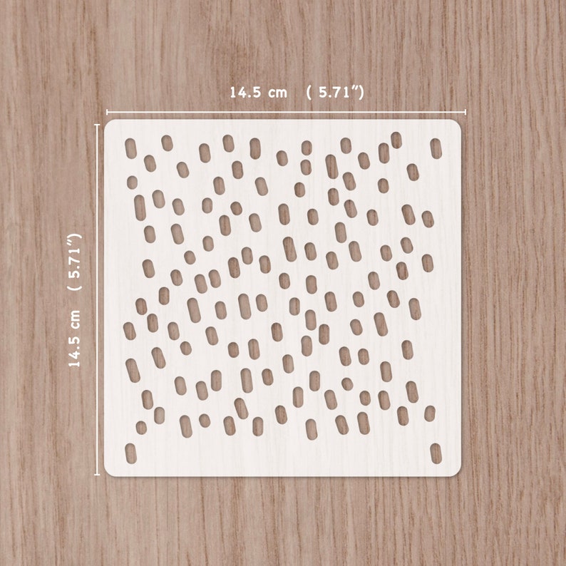 May include: White plastic stencil with a 5.71 inch by 5.71 inch square design of small and medium sized circles and ovals. The stencil is for crafting and decorating.