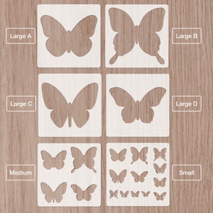 May include: A set of four butterfly stencils in different sizes. The stencils are labelled "Large A", "Large B", "Large C", "Large D", "Medium", and "Small".