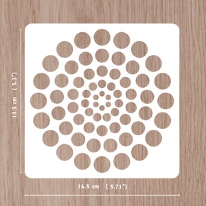 May include: White stencil with a circular design of 50 circles of varying sizes, arranged in a spiral pattern. The stencil measures 5.71 inches by 5.3 inches.