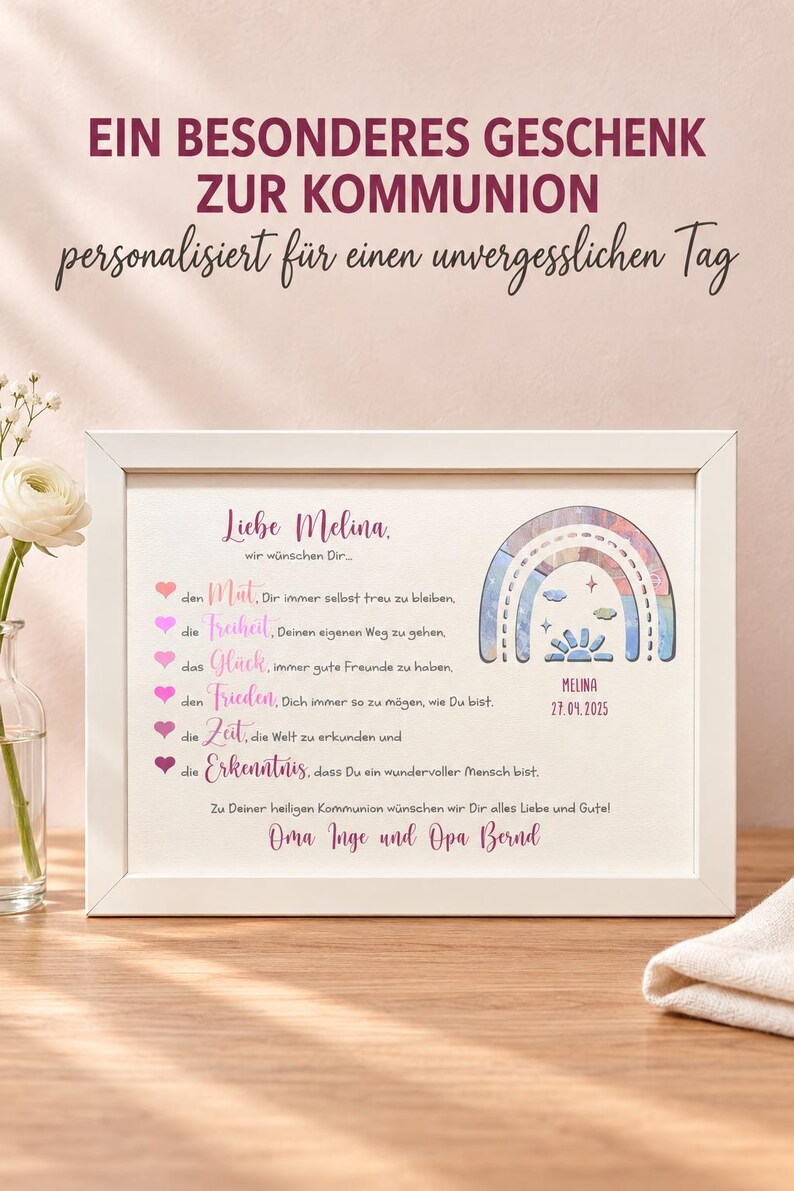 May include: A white framed print featuring the text 'Liebe Melina' and a list of wishes marked by pink hearts. The design includes a colorful rainbow illustration with the name 'MELINA' and the date '27.09.2025' printed below it in a white frame.