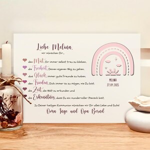 May include: A rectangular white card featuring a pink rainbow graphic, the name Melina, and the date 27.04.2025. The text includes German phrases starting with Liebe Melina, followed by a list of wishes and a closing from Oma Inge and Opa Bernd.