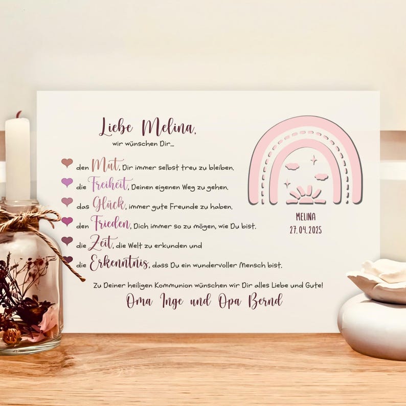 May include: A rectangular white card featuring a pink rainbow graphic, the name Melina, and the date 27.04.2025. The text includes German phrases starting with Liebe Melina, followed by a list of wishes and a closing from Oma Inge and Opa Bernd.