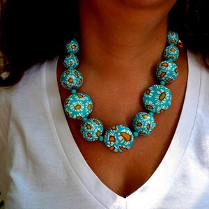 Handmade polymer clay necklace: "A blanket of daisies," from the Welcome Spring series.