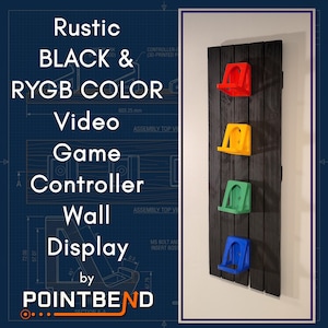 May include: A vertical wall-mounted display rack featuring four individual controller holders in red, yellow, green, and blue. The holders are attached to a dark, stained wooden plank backing. The text on the image reads Rustic BLACK & RYGB COLOR Video Game Controller Wall Display by POINTBEND.