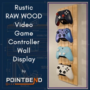 May include: A vertical light-colored wooden wall mount holding four video game controllers. The controllers are black, metallic blue, light blue, and white. The text on the left reads: Rustic RAW WOOD Video Game Controller Wall Display by POINTBEND.