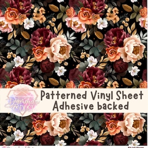 May include: Patterned vinyl sheet with a floral design. The design features large, colourful flowers in shades of burgundy, peach, and cream, set against a black background. The text "Patterned Vinyl Sheet Adhesive backed" is visible.