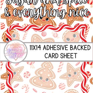 May include: An 28x36 cm adhesive-backed card sheet with a festive pattern of gingerbread men, stars, and trees with smiling faces, candy canes, and candies on a white background. The text "Sugar and spice & everything nice" is displayed at the top.