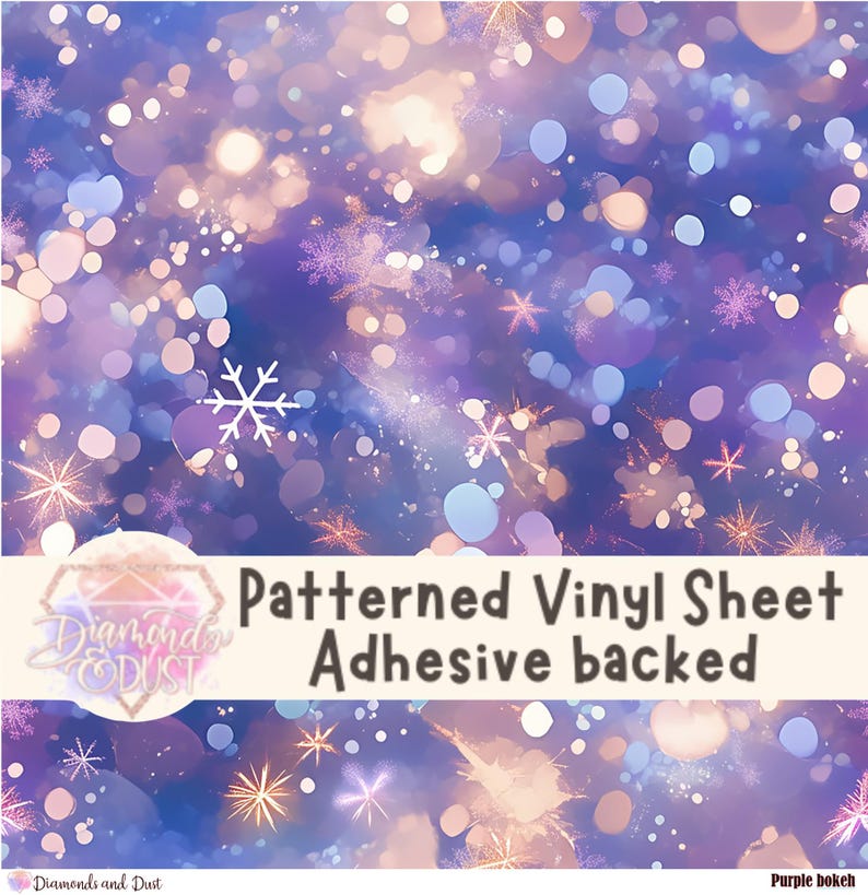 May include: A patterned vinyl sheet with an adhesive backing. The design features a bokeh effect with shades of purple, blue, and white, with snowflake and starburst accents. The text "Patterned Vinyl Sheet Adhesive backed" is visible.