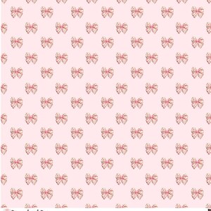 May include: A seamless pattern featuring pink and gold bows on a light pink background. The bows are decorated with small gold dots.