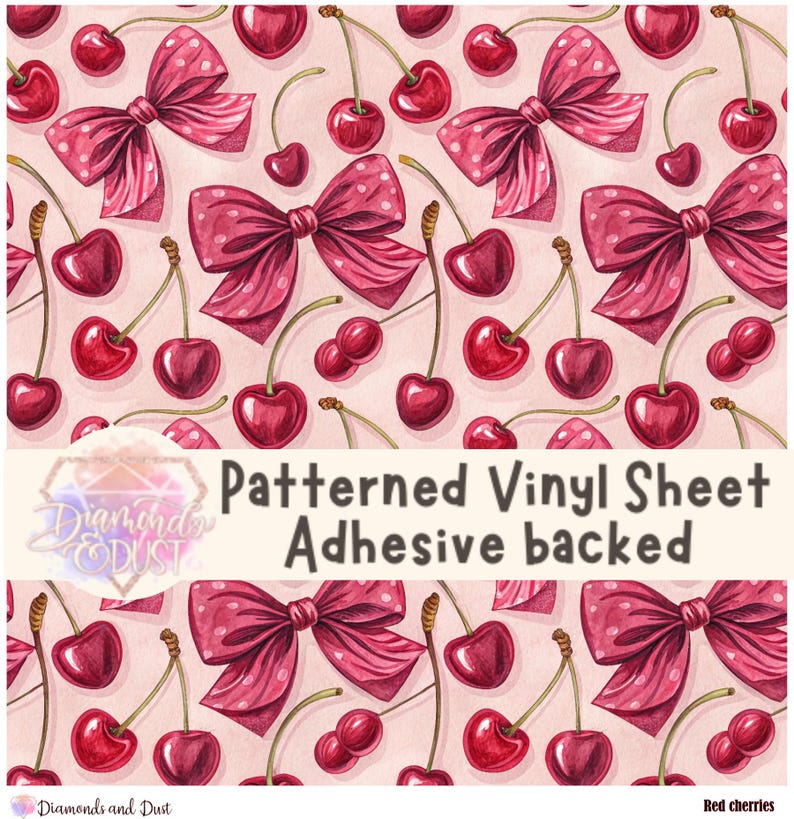 May include: Patterned vinyl sheet with a repeating design of red cherries and pink bows with white polka dots. The text on the sheet reads "Patterned Vinyl Sheet Adhesive backed".