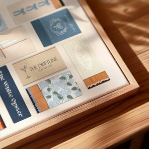 Blue coastal wall art print of a matchbook collection – nautical home decor idea for living room or entryway.