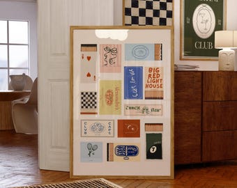 May include: A framed art print featuring a collection of colorful matchbox designs, including playing card suits, abstract illustrations, and text. Additional framed art includes a black and white checkerboard and a green "Martini Club" poster. The artwork is displayed in a well-lit room.