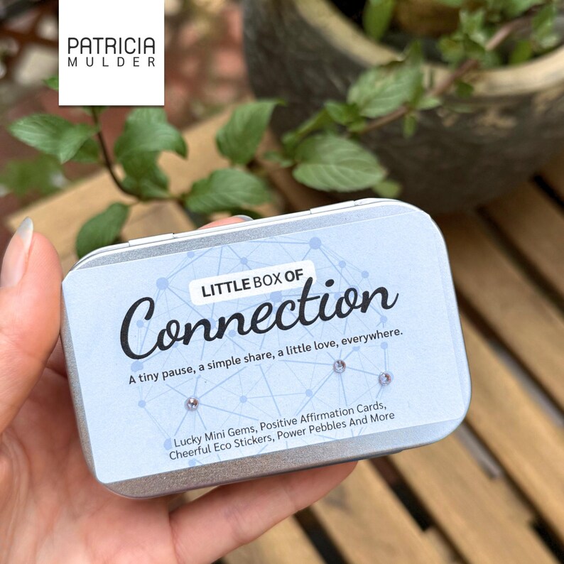 Little box of connection made to inspire and bring people together. Includes discovery papers that ask meaningful prompts and power glass pebbles with you are kind, you are strong and other versions. Also 9 affirmation cards, and a small glassine envelope with 6 little gemstones. There’s also a paper pouch with 3 eco friendly stickers in this box. You can pick a blue, yellow or green front and citrine, amethyst or rose quartz gems. Share with friends, lift spirits and gift the gift of connection