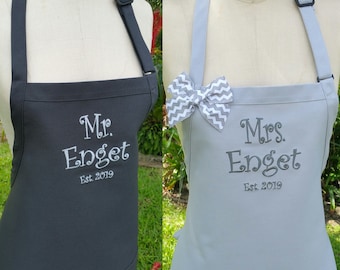 Couples Personalized Aprons / Charcoal and silver Apron with  grey embroidery thread color and bow/ Mr. & Mrs. Wedding Aprons .