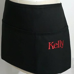 Waitress black waist Apron with pockets /  Half apron embroidery in red / Hostess gift idea/ Restaurant apron/ Quality restaurant apron .