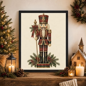 May include: A framed wall art print featuring a detailed illustration of a nutcracker soldier wearing a red and green plaid uniform, a matching hat, and black boots. The figure holds a tall staff adorned with a plaid bow, surrounded by pine branches.