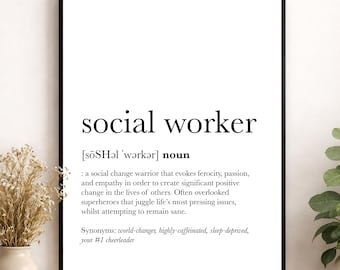 May include: A framed wall art print featuring a dictionary-style definition of the noun social worker. The text includes the phonetic spelling, a descriptive definition of a social change warrior, and a list of synonyms including world-changer.