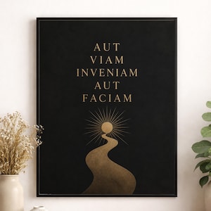 May include: Black framed wall art with gold text that reads "AUT VIAM INVENIAM AUT FACIAM". The artwork features a gold sunburst and a winding path design in gold against a black background. Decorative home decor.