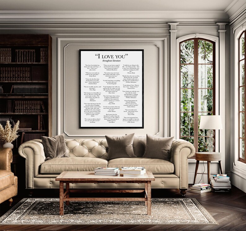 May include: A framed wall art print titled "I LOVE YOU" throughout literature, featuring a collection of romantic literary quotes in black text on a white background, displayed in a simple black frame hanging on a light-colored wall.