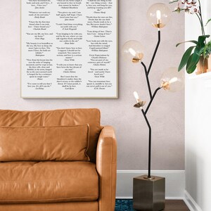 May include: A rectangular wall art print featuring the text "I LOVE YOU" throughout literature, displaying various literary quotes in black font on a white background. The print is framed in a light wood frame and hung on a wall.