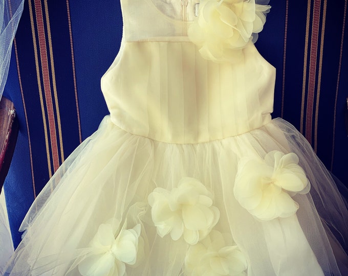 Girls dress in Off white with a hint of pale yellow